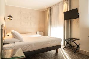Llit o llits en una habitació de Hotel José Nogueira