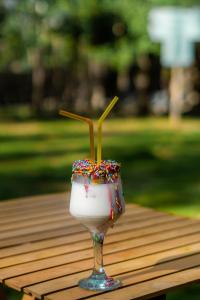 a glass of ice cream with sprinkles on a table at Maple Resorts in Skardu