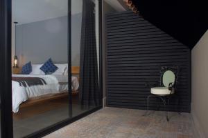 Postel nebo postele na pokoji v ubytování Hotel Helverica