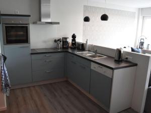 a kitchen with a sink and a counter top at Nice apartment in Neuenkirchen in Neuenkirchen