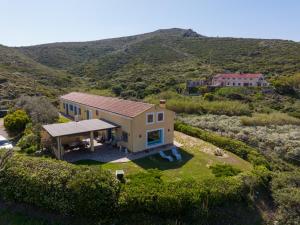 an aerial view of a house on a hill at B&B Calata Di Soli in Miniera dellʼArgentiera