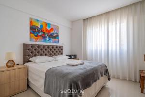 Katil atau katil-katil dalam bilik di Apto c/ varanda e churrasq. 400m praia DBR0805