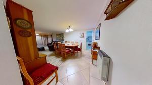 a living room and dining room with a table and chairs at Altos de San Alfonso in Algarrobo