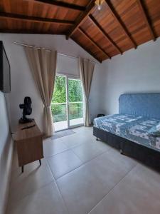 Posteľ alebo postele v izbe v ubytovaní Aconchego em Ilhabela