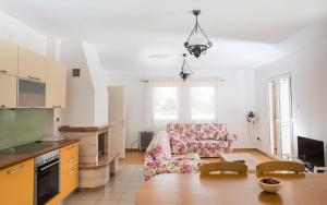 a living room with a couch and a table at Krašograd in Pisarovina