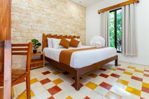 Ein Bett oder Betten in einem Zimmer der Unterkunft Hotel Boutique Casa Hipil