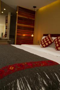 Кровать или кровати в номере Hotel Helverica