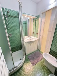 a bathroom with a sink and a shower at San Filippo Studio Biella Centro in Biella