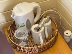 a basket filled with appliances on a table at Belle Vista Glamping & Camping in York
