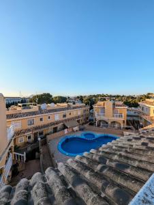 a view from the roof of a building with a swimming pool at 2 Bedroom Algorfa Townhouse with Pool in Castillo de Montemar