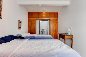 Ένα ή περισσότερα κρεβάτια σε δωμάτιο στο Casa Palaxs +14 φωτογραφίες