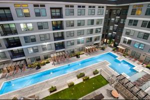 an overhead view of a building with a swimming pool at Lux 3BR Near Truist Park & Mall in Atlanta
