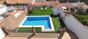 an aerial view of a house with a swimming pool at SIERRA LAGO in Córdoba