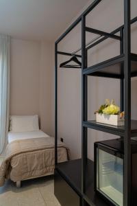 Postel nebo postele na pokoji v ubytování Elide Design Hotel