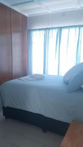 Uma cama ou camas num quarto em Alhoa Halfway Stop