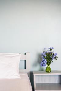 Кровать или кровати в номере Romeo Seaside Luxury Suite