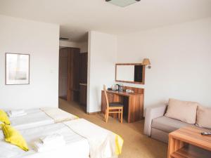Łóżko lub łóżka w pokoju w obiekcie Hotel Beskidian