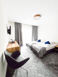 Łóżko lub łóżka w pokoju w obiekcie Hotel Beskidian