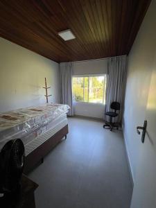 Postel nebo postele na pokoji v ubytování Casa de Campo - Rancho dos Lagos