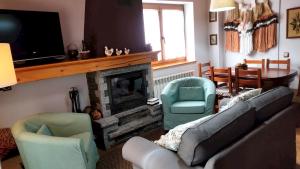 A television and/or entertainment centre at Charming Chalet in Viella, Mountain View