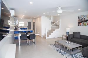 a living room with a couch and a table at 232D South Finger in Jolly Harbour