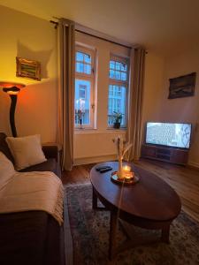 TV a/nebo společenská místnost v ubytování Ferienwohnung Nispel