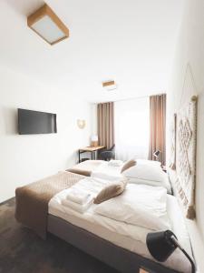 Łóżko lub łóżka w pokoju w obiekcie Hotel Beskidian