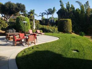 a group of chairs and tables sitting on a patio at Best Ocean & Bay Views in SD Large Backyard Air Conditioning in San Diego