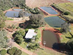 an aerial view of a group of ponds at Casa de Campo - Rancho dos Lagos in Cascavel