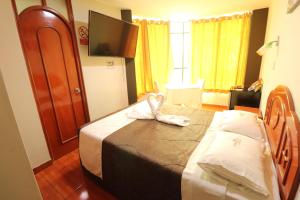 Postel nebo postele na pokoji v ubytování Hotel Frontera