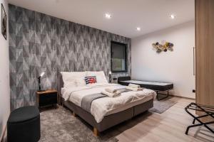 Postel nebo postele na pokoji v ubytování Duna Rév Apartman