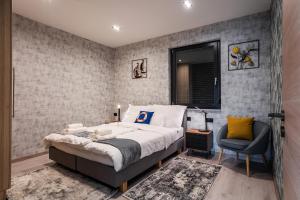 Postel nebo postele na pokoji v ubytování Duna Rév Apartman