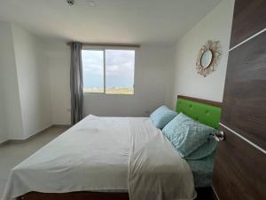 Postel nebo postele na pokoji v ubytování Departamento Coral Vía a Data