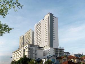 a tall white building with many windows at Best Western i-City Shah Alam in Shah Alam