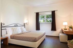 Postel nebo postele na pokoji v ubytování Hydra Beach Resort