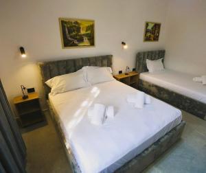 Postel nebo postele na pokoji v ubytování VILA ALIZEE Hotel