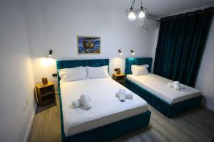 Postel nebo postele na pokoji v ubytování VILA ALIZEE Hotel