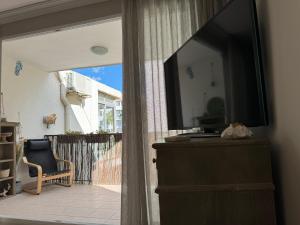 TV a/nebo společenská místnost v ubytování Beach Flat Albir,Esmeralda