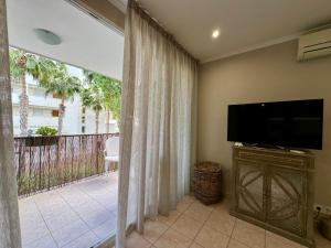 TV a/nebo společenská místnost v ubytování Beach Flat Albir,Esmeralda