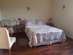 Een bed of bedden in een kamer bij Pousada As Relíquias de Minas