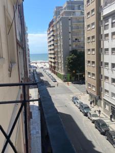 a view from a balcony of a street with parked cars at Excelente ubicación in Mar del Plata