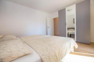Postel nebo postele na pokoji v ubytování Apartments Marija