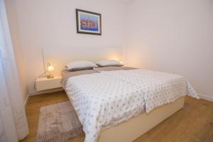 Postel nebo postele na pokoji v ubytování Apartments Marija
