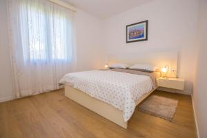 Postel nebo postele na pokoji v ubytování Apartments Marija
