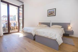 Postel nebo postele na pokoji v ubytování Apartments Marija