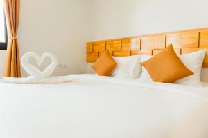 Voodi või voodid majutusasutuse AIMI Beach Hotel toas