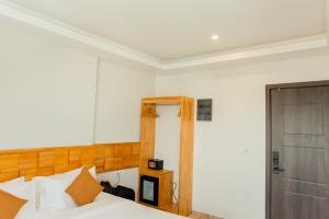 Voodi või voodid majutusasutuse AIMI Beach Hotel toas