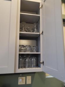 a cupboard filled with lots of glass jars at HB North Bears Lair in Thomas