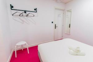 Postel nebo postele na pokoji v ubytování Koala Hostel Mercado