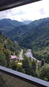 a view of a river and a road in a valley at Gülhan Butik Hotel & Bungalov in Rize